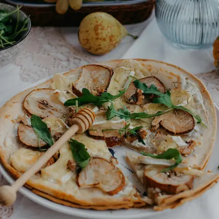 Sweet and savoury fruit pizza topped with caramelized pear.
