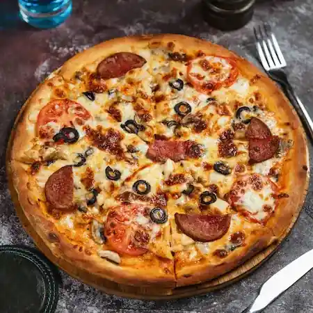 Delicious pepperoni and sausage pizza made entirely of plant-based/vegan alternatives.